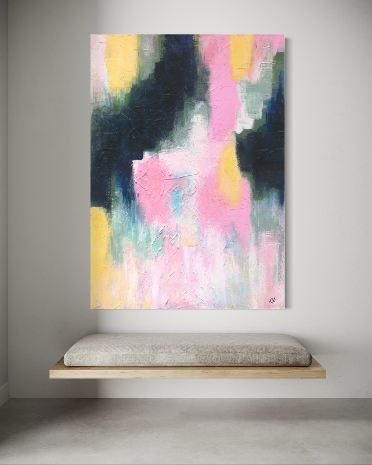 Abstract painting with colorful brush strokes on a gray wall above a floating bench.